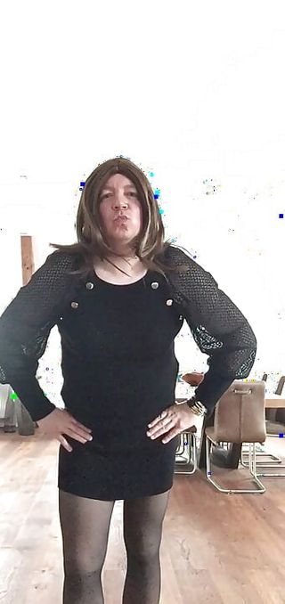 Nicki-Crossdress in a black Mini-Dress, black Pantyhose and Sneaker