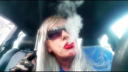 MRS. ROMAN DESTROYING A MARLBORO 100 MENTHOL CLOSE UP - WITH DANGLING AND NOSTRIL EXHALES