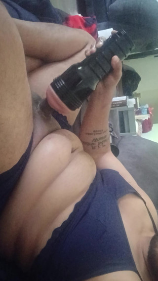Jerking off with my flashlight dressed in a bra and panties thumbnail