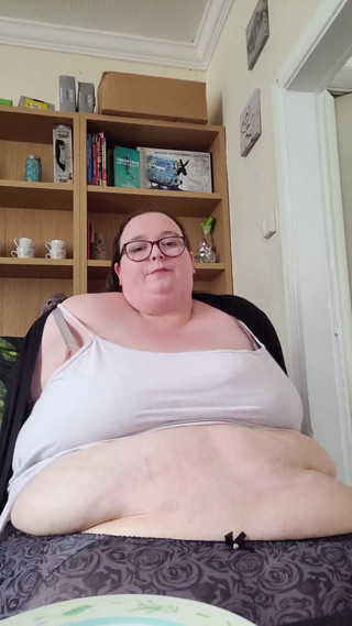 Eating cake and jiggling this massive belly
