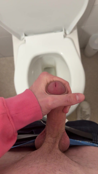 Twink wixes his big cock on the toilet