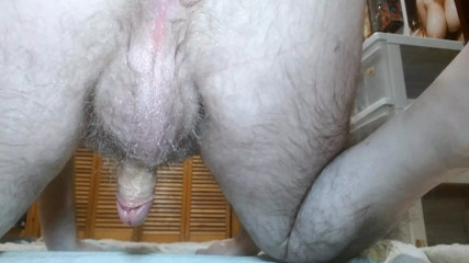 Oiled up and completely naked. Not even socks. Showing you everything and masturbating.