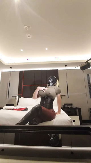 Busty sissy bimbo sitting on bed at hotel room thumbnail
