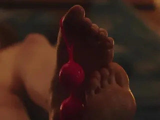 Footjob from a young bitch with balls in her fingers