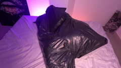Girl in Garbage Bag Plays with Her Breath