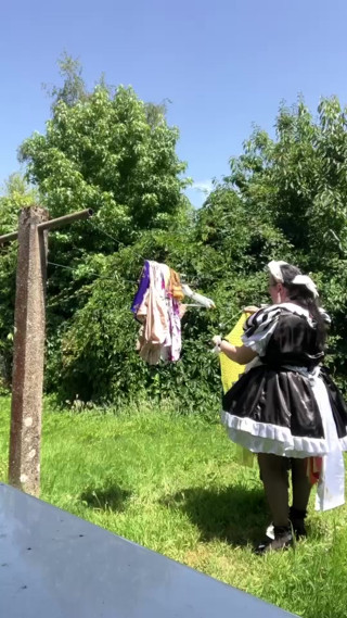 In a black and white maid outfit to hang out the laundry. thumbnail