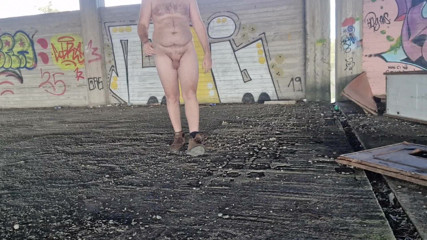 I pose completely naked in the backyard
