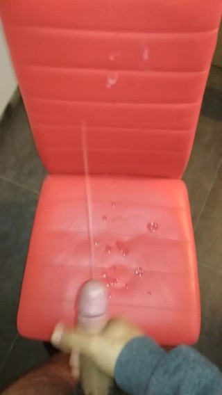 Cumming on a red chair