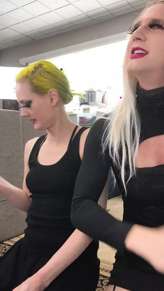 Drag Queen and Woman Putting on Lipliner and Lipstick