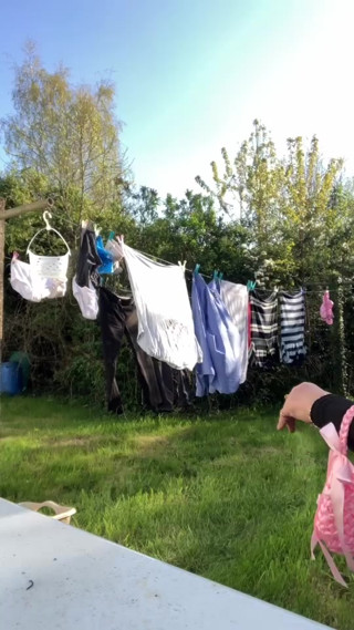 In attire with a schoolgirl dress to gather laundry and for an evening out. thumbnail