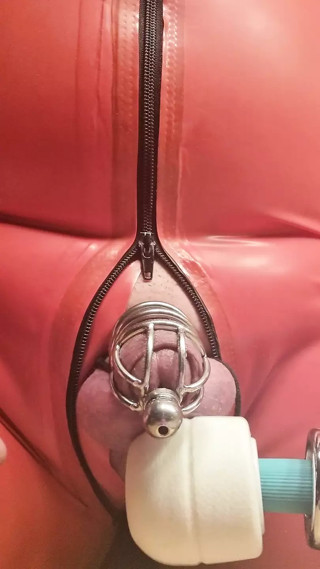 Milked the penis cage in a latex catsuit with MagicWand