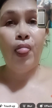 taking a bath and showing her beautiful face .