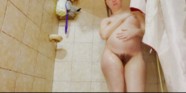 A 19-week Pregnant Woman Showers, Focusing on Her Tattooed and Hairy Buttocks and Rear