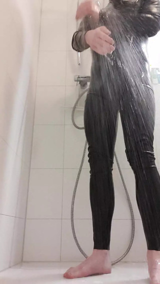 In the shower with a latex suit