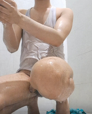 Naked boy takes a shower in bathroom