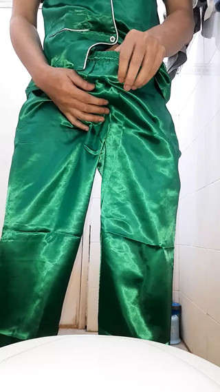 Crossdresser masturbate and cum wearing shiny satin pajamas