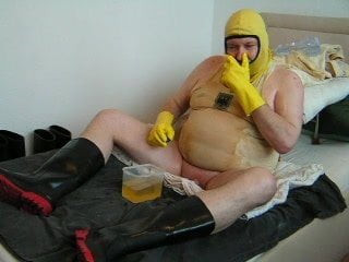 The Fat Piss-Pervert In Black N Red Rubber Wellies