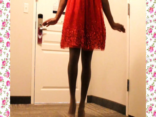 A 1950's SISSY DANCE FOR HER HUSBAND WEARING A PARTY DRESS