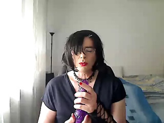 horny MILF tranny simulates giving her partner a Blowjob on webcam while playing with a vibrator in her mouth thumbnail