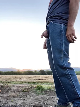 Sunset by a hay field
