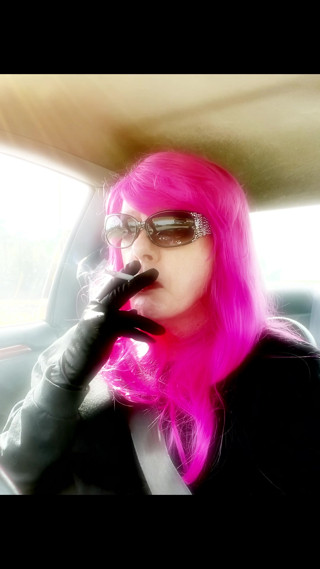 Mrs. Roman TG with Pink Hair and leather gloves smoking VS120s Menthol driving CD mature ladyboy smoking fetush thumbnail