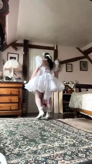 In a short wedding dress outfit to become a maid for a day