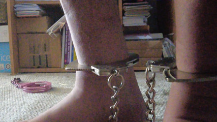 Male Slave with sports socks and Smith and Wesson Leg Irons