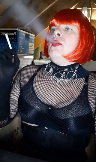 Redhead with red lips smoking