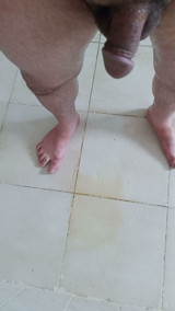 I pee on the bathroom floor, then sat on my pee and began masturbating