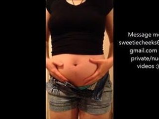 Stuffed swollen belly in tight clothes