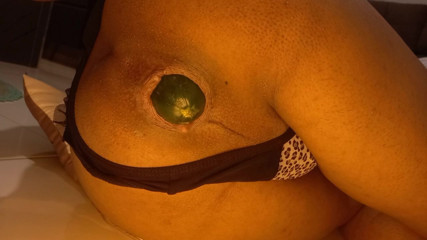 Naughty shemale opens her ass with a huge cucumber and I love it.