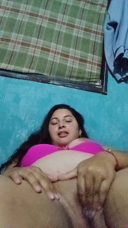 Chubby Latina with big tits chews her rich wet pussy