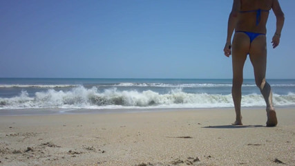 Shiny royal blue thong on the beach thumbnail