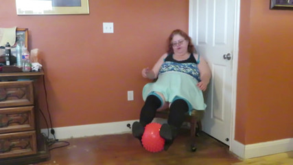 Nurse Vicki  plays with a rubber ball in a mini skirt, sexy stockings and high heel mini boots