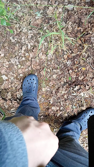 Boy pissing in the forest