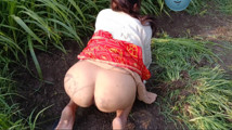My elder sister-in-law is tormenting in the field of millet by undressing her clothes and putting fingers in her pussy.