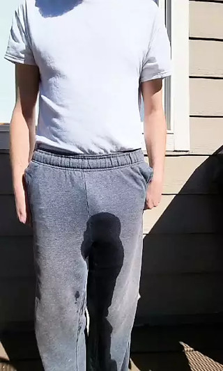 Sissy fag loser pees her pants outside.