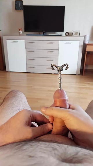 Urethral cock sounding play and cumshot through hollow sounding plug