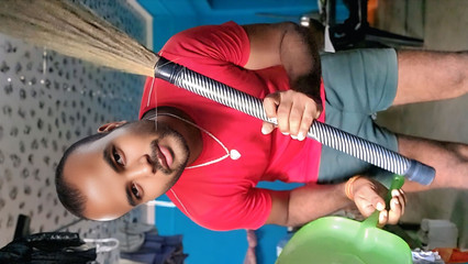 Indian boy is sweeping the house naked