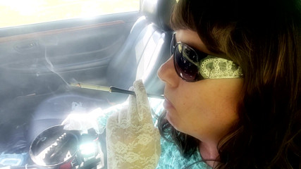 MRS. ROMAN HOLDER SMOKING VS120s WITH WHITE LACE GLOVES AND SUNGLASSES thumbnail