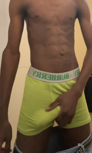 Sexy teen with abs stroking his big black cock in public