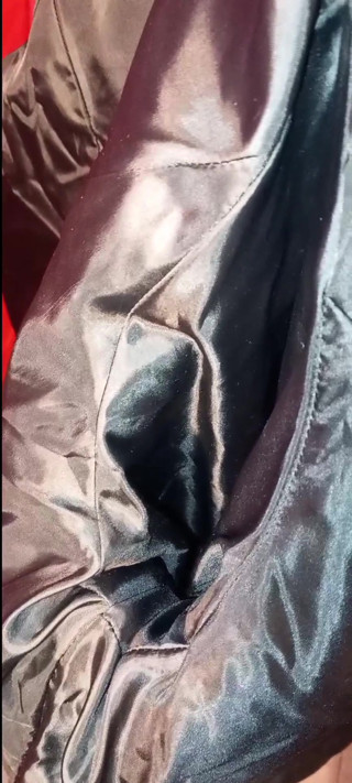 Masturbating on the lining of her black puffercoat