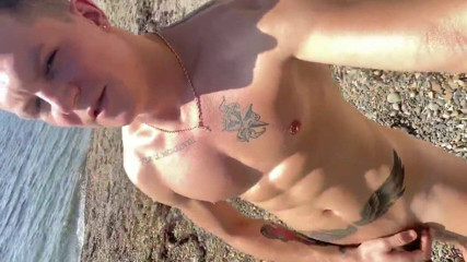 I'm sunbathing naked in oil on the city beach