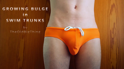 growing bulge in orange swim trunk - what every boy fears and girls dreaming of