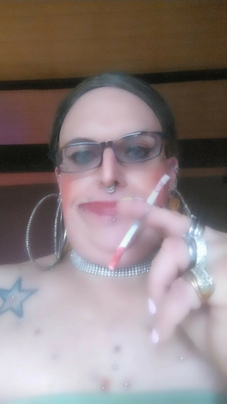 StefanieTs with piercings and tattoos smoking