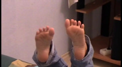 Reading newspaper and relaxing tired feet