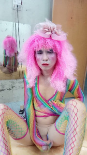 Transgender Le wears sexy clothes and plays cups of sex. Artificial cans