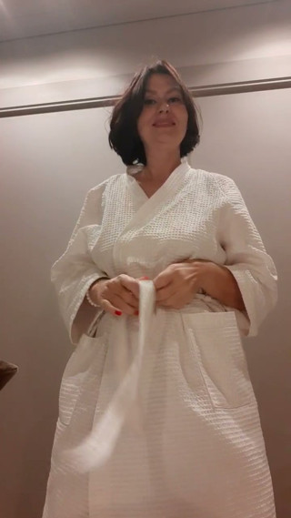 She knitted a blue accountant and tried on the details on her nipples