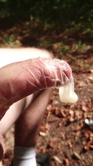 Cum in condom on public bench