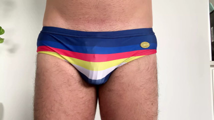 Caging uncut cock in a speedo